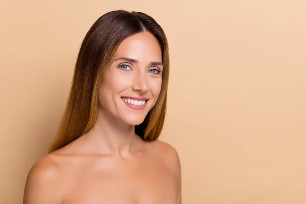 A woman with smooth, radiant skin smiling confidently after Botox treatment.