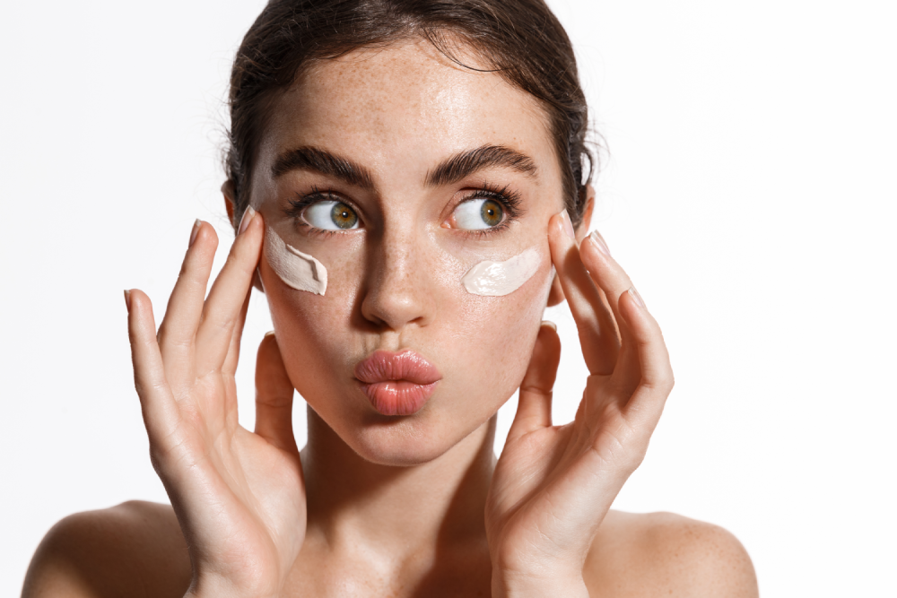 Woman applying cream for hyperpigmentation